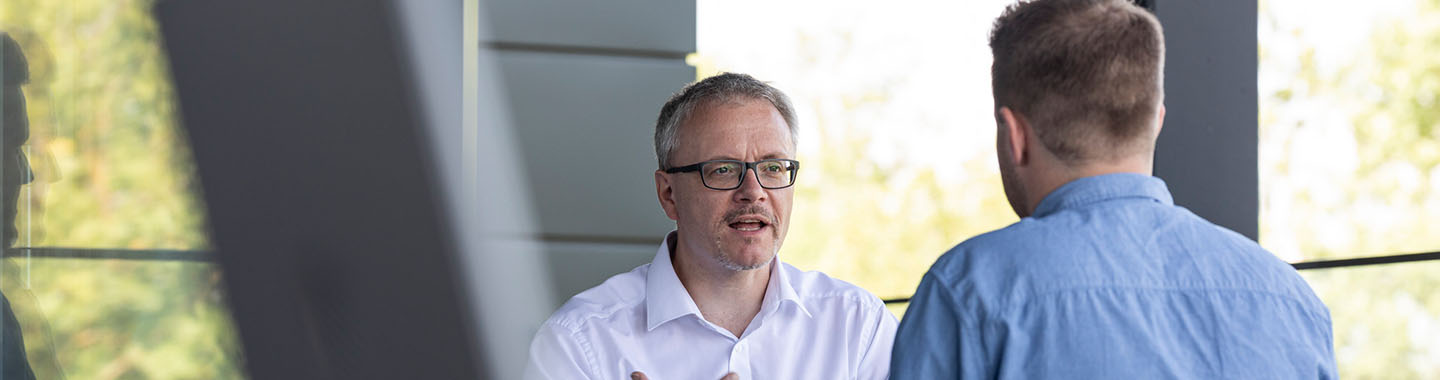 2 Men talking to each other