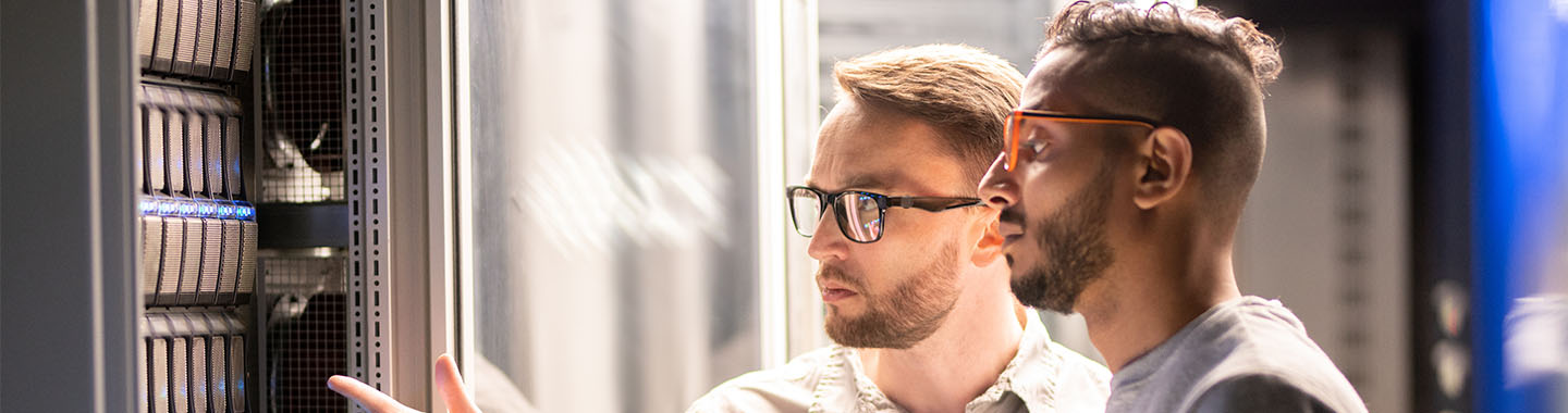 Two men looking at a datacenter