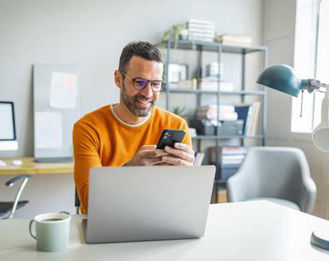 Man working on phone banner