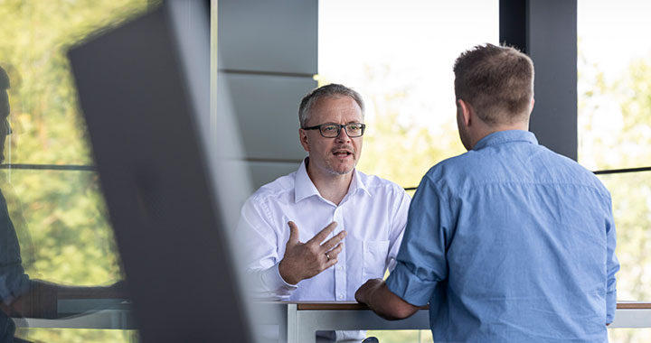 2 Men talking to each other