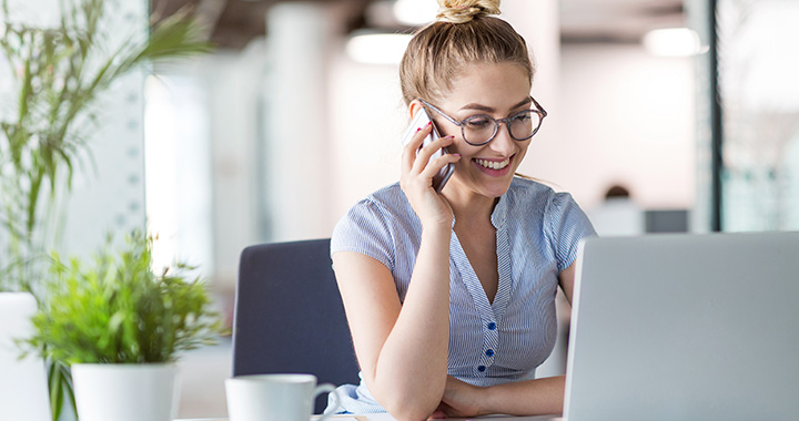 Woman with smartphone and Laptop