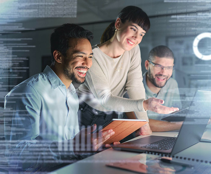 Team looking at Laptop