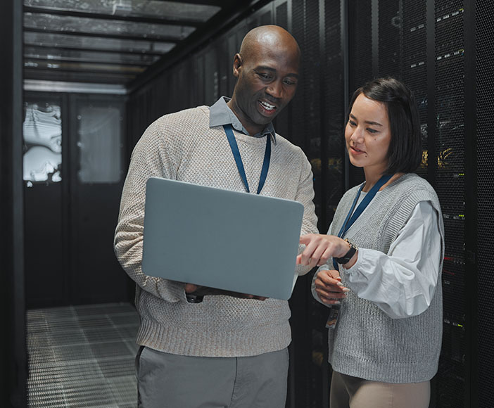 Man and woman looking at notebook