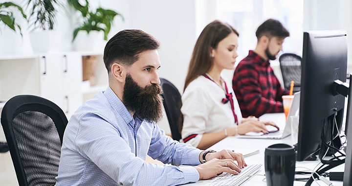 Man working in front of desktop