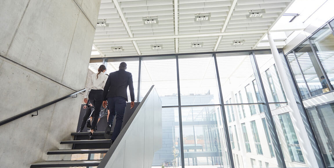 Man and woman walking up stairs