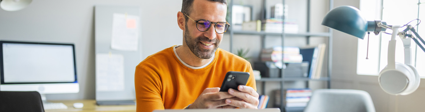 Man working on phone banner