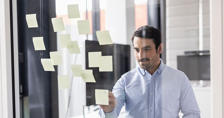 Man looking at notes