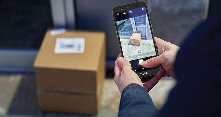 6Grid Banner Person photographing a package indoors with a Zebra Terminal 