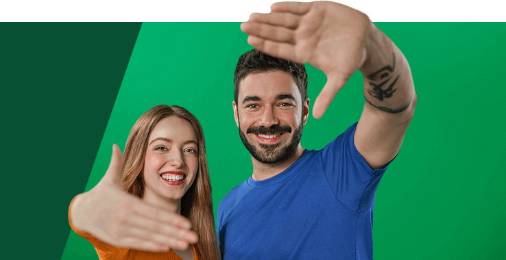 A group of two people smile at the camera and extend their hands invitingly.