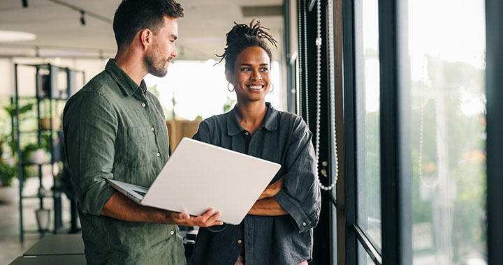 Woman and man looking out of the window