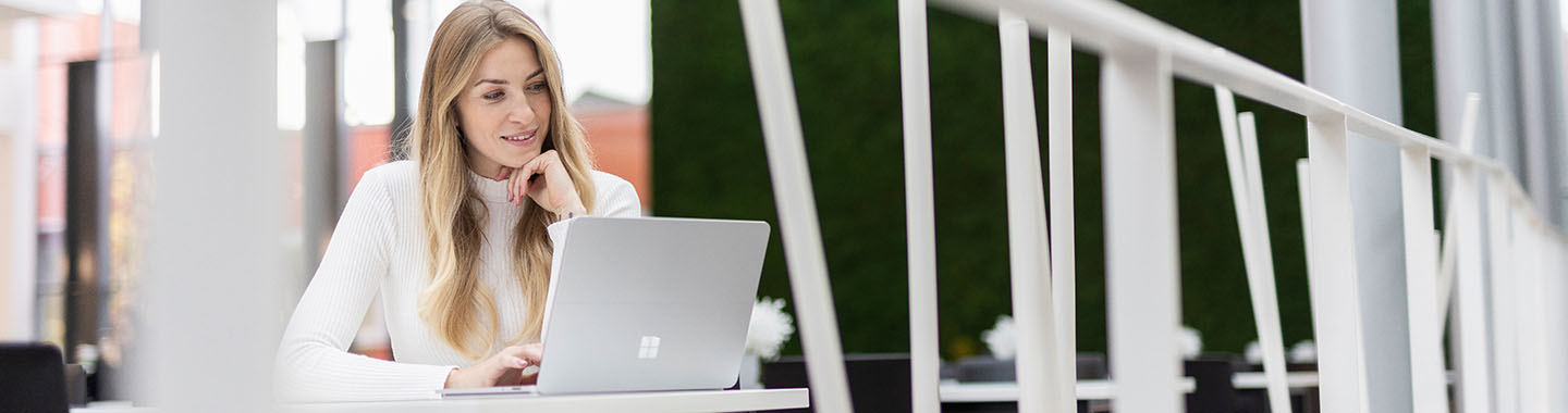 Woman working on Surface tablet