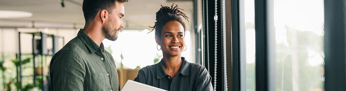 Woman and man looking out of the window