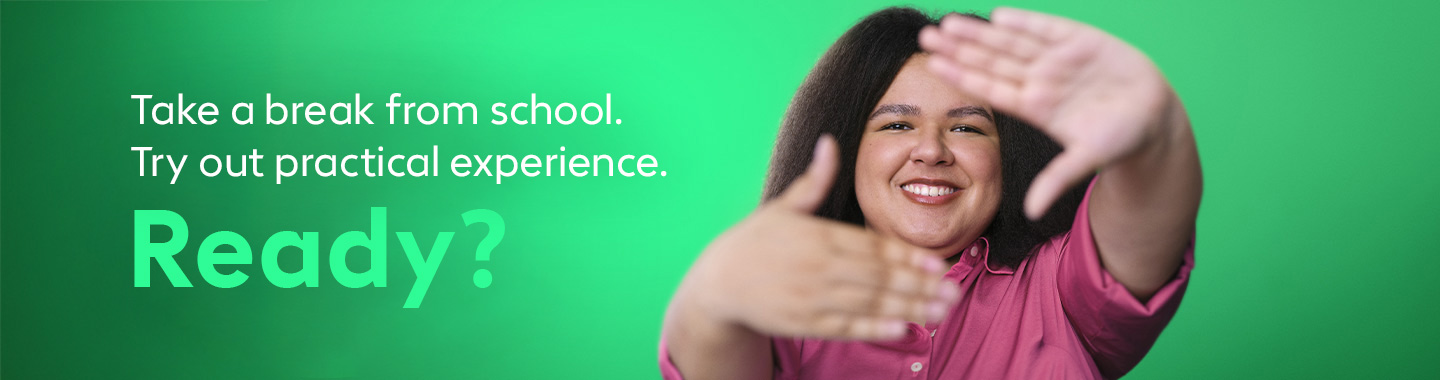 A young woman smiles at the camera and extends her hands invitingly.